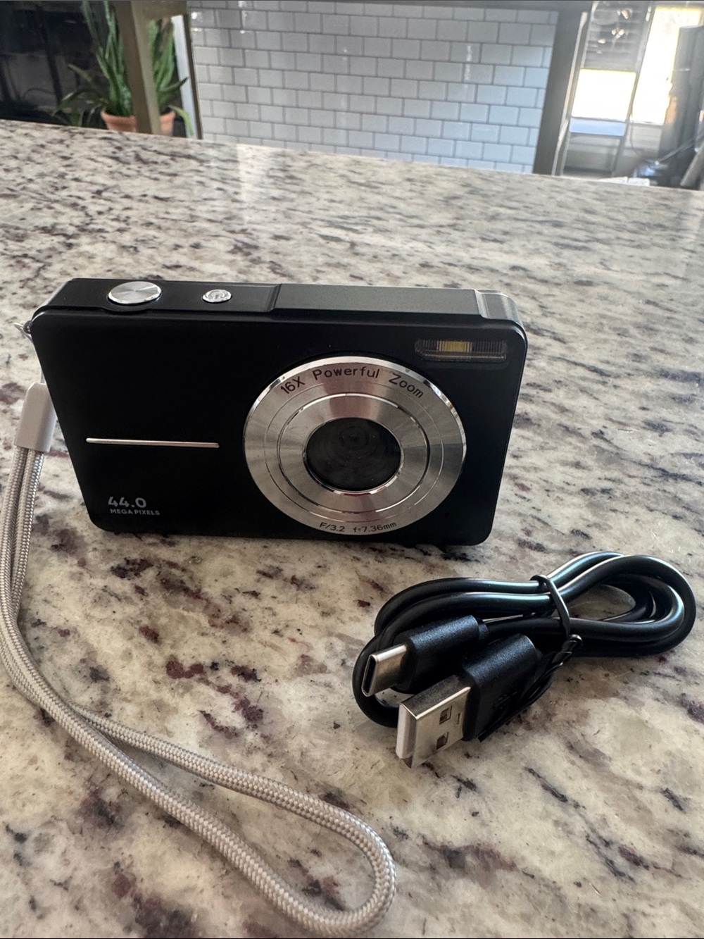 Compact Black Digital Point-and-Shoot Camera with USB Cable